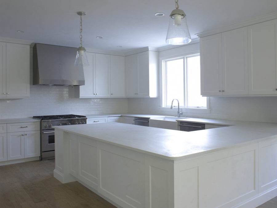 A spotless kitchen with bare, gleaming countertops