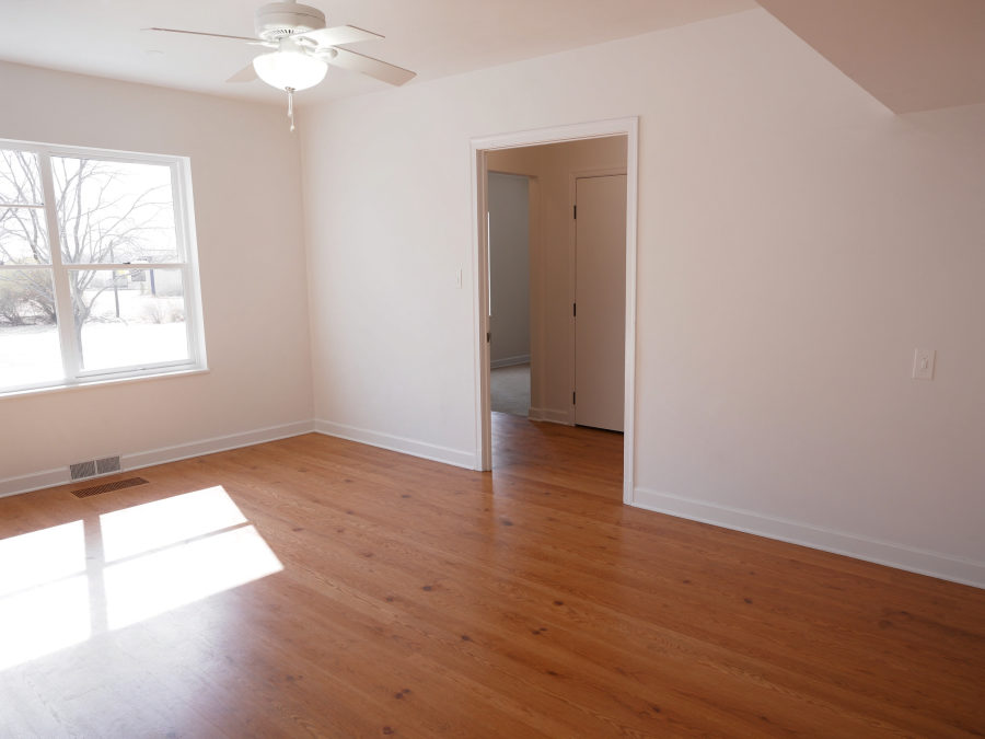 An empty bedroom cleaned and ready for a new tenant